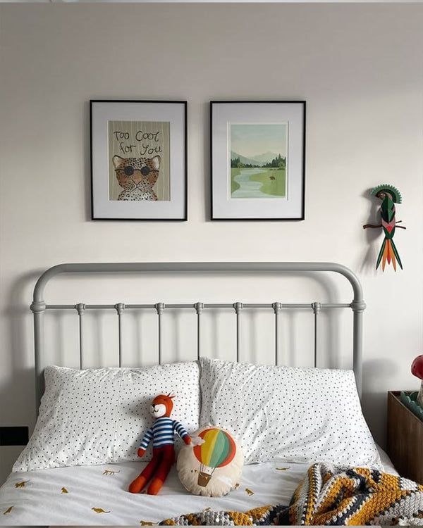 Alternative lifestyle display of the Too Cool print framed near modern children toys